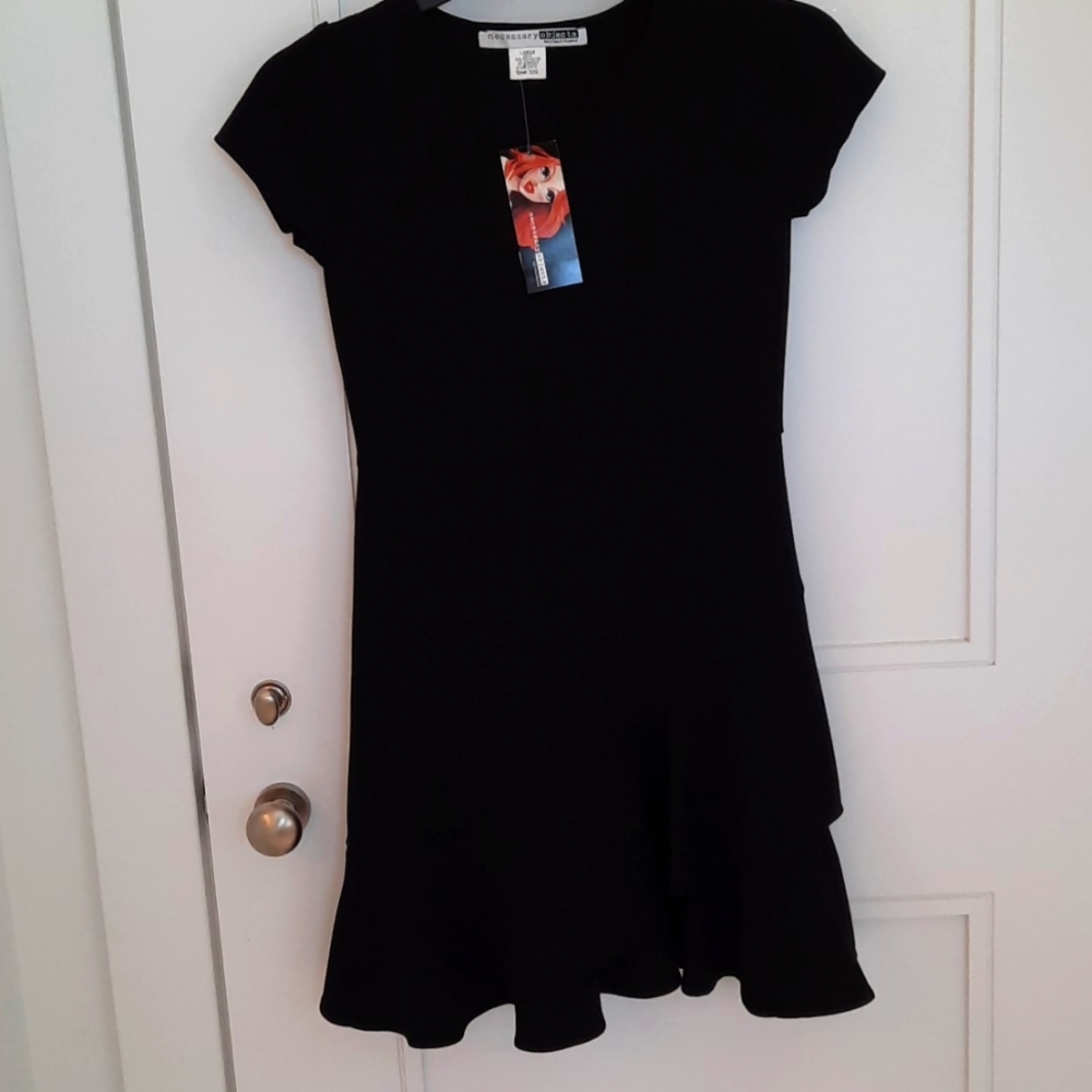 Black Crepe Dress slanted ruffle on the bottom. Size Large